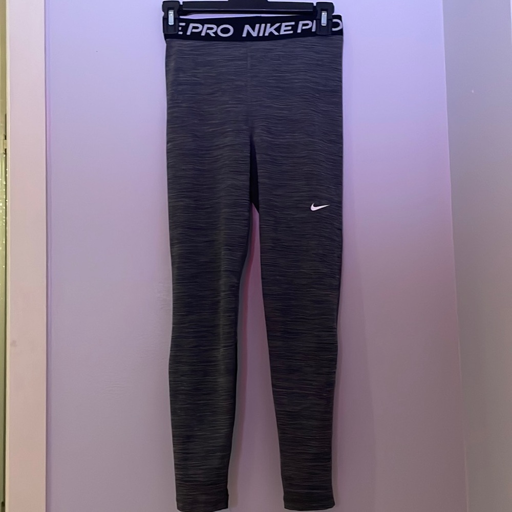 Nike leggings. Grey and black mesh at the bottom.